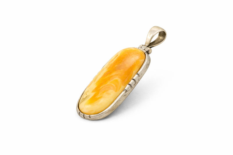 Elongated amber pendant